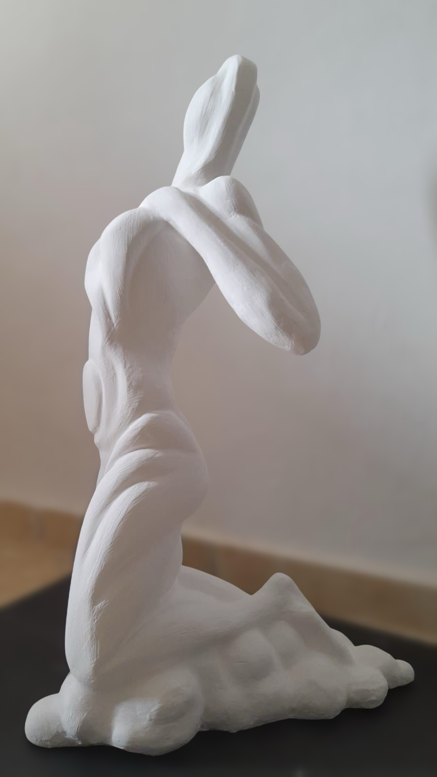 Kneeling marble figure